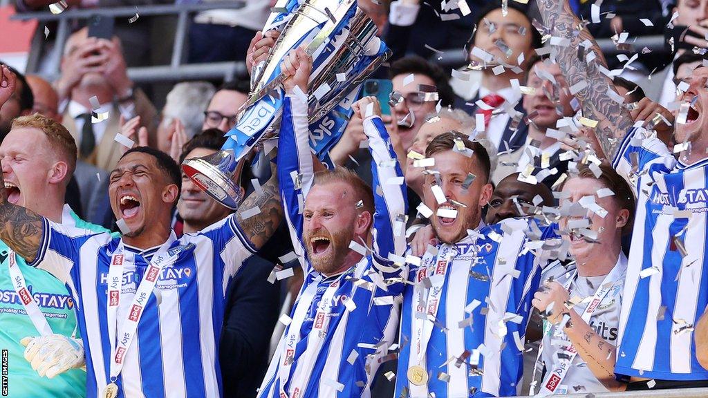 Sheffield Wednesday players lift trophy