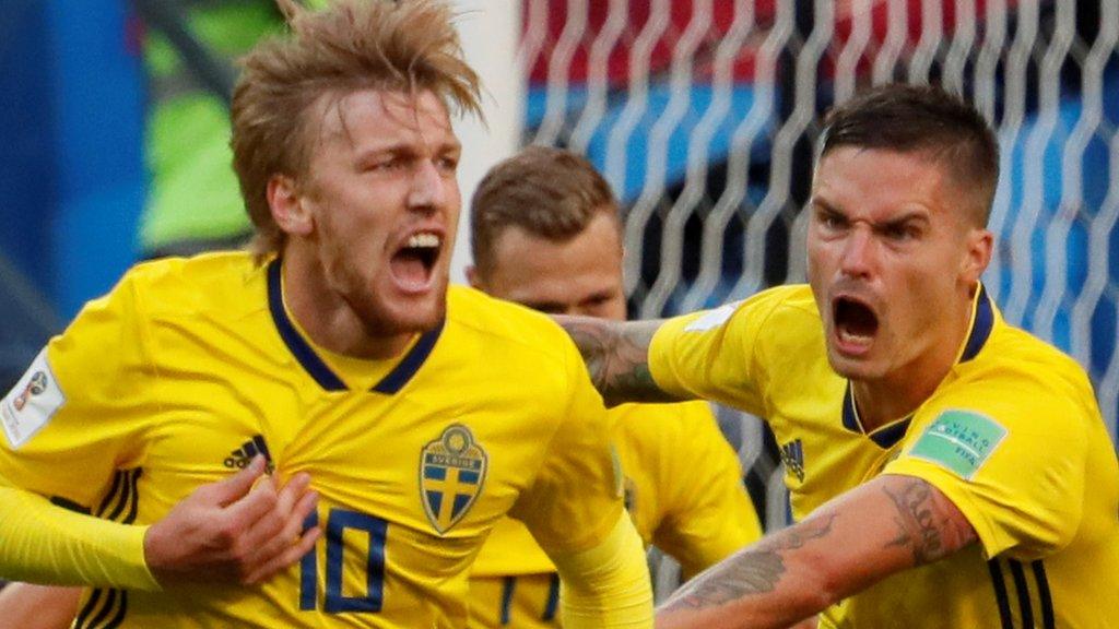 Sweden's Emil Forsberg and Mikael Lustig celebrate the winning goal against Switzerland