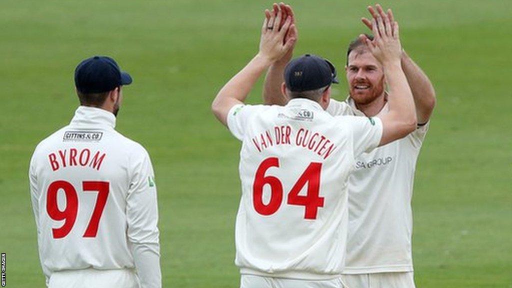 James Harris celebrates with Glamorgan teammates