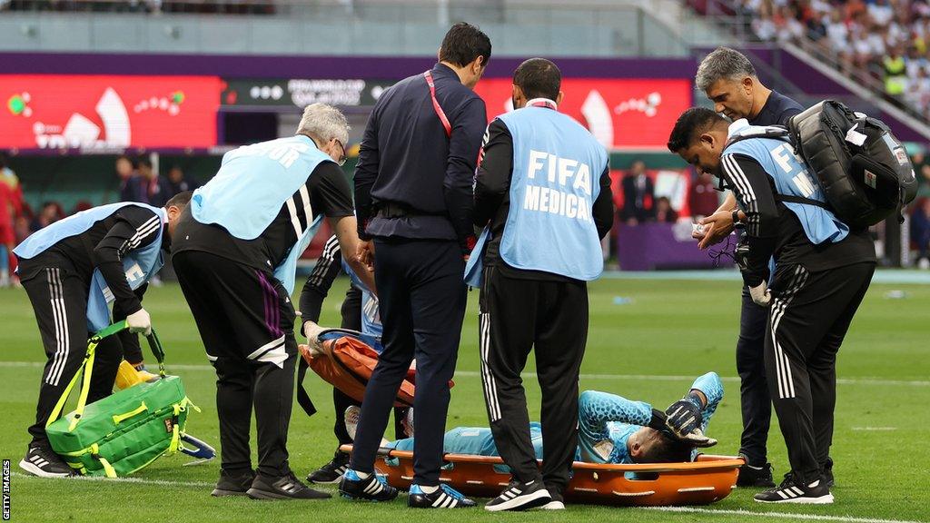 Iran goalkeeper Alireza Beiranvand on stretcher