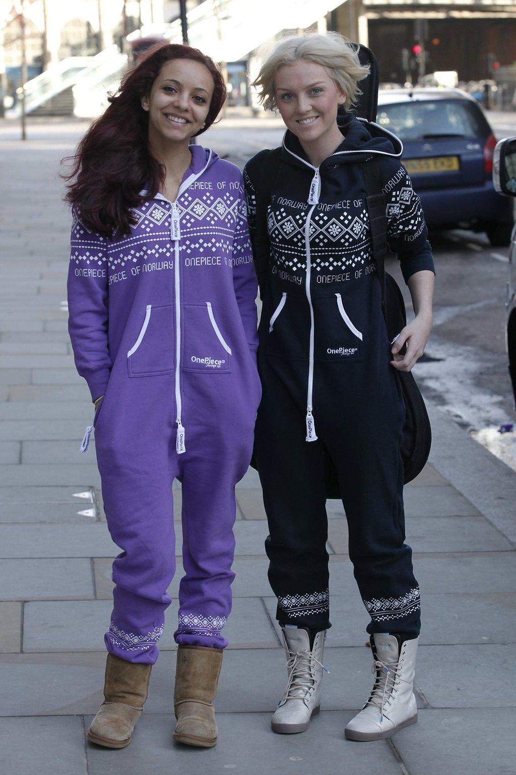 Jade Thirlwall and Perrie Edwards pose outside a hotel in 2011