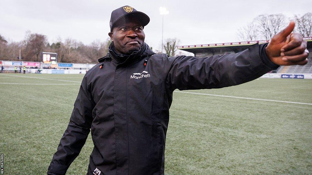 George Elokobi celebrates Maidstone's win against League One Stevenage in the FA Cup third round