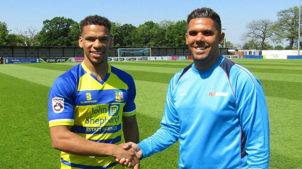 New signing Kalern Thomas is welcomed to Damson Park by Solihull manager Liam McDonald