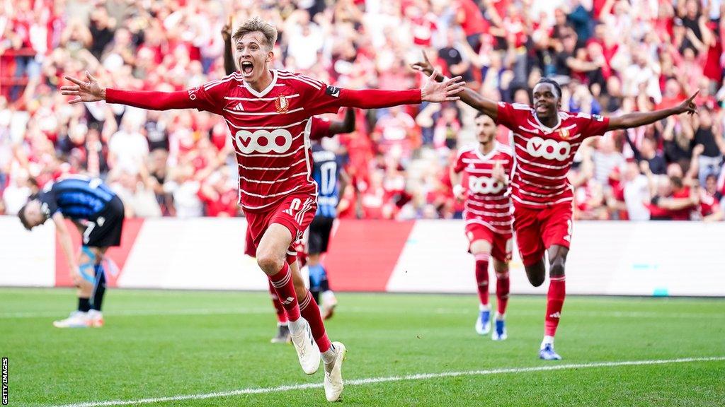 Isaac Price celebrates scoring a late winner for Standard Liege