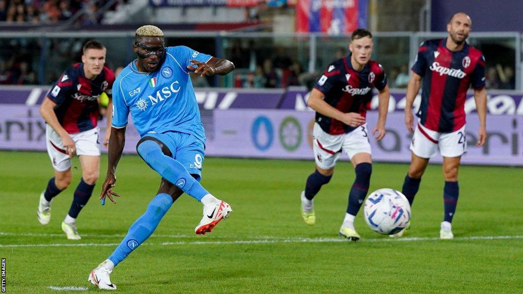 Victor Osimhen kicks a football