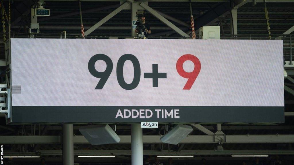 The big screen at Brentford showing nine minutes of stoppage-time