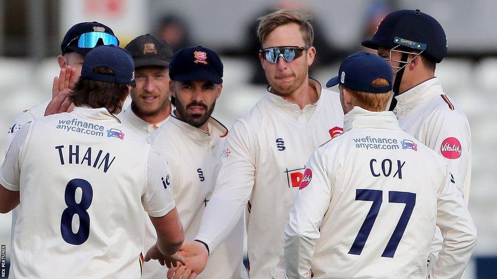 Essex celebrate taking a Lancashire wicket