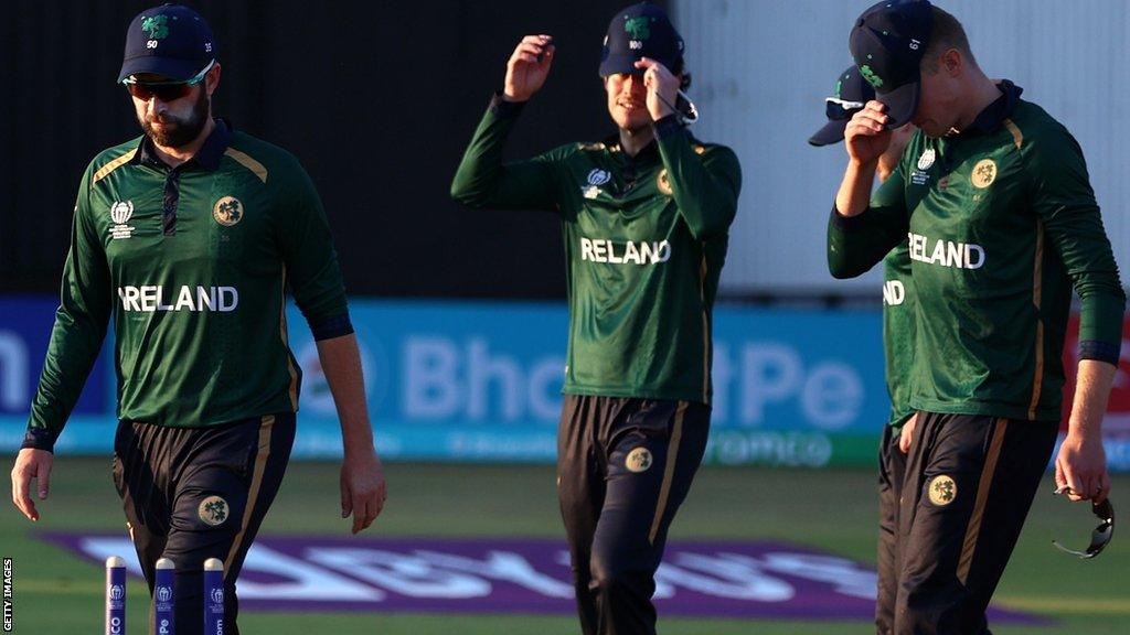 Andrew Balbirnie (left) and Ireland team-mates show their disappointment after the crucial defeat by Scotland at the recent World Cup qualifier in Zimbabwe