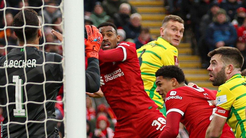 Ben Gibson scores for Norwich against Liverpool