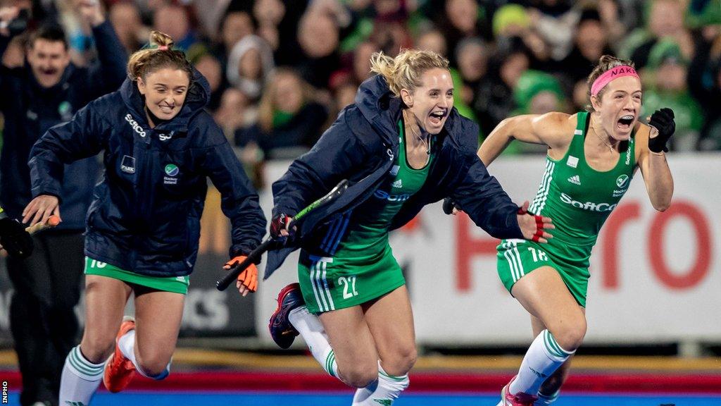 Irish players Gillian Pinder, Nicola Daly and Bethany Barr celebrate the moment they qualified for the 2020 Tokyo Olympics