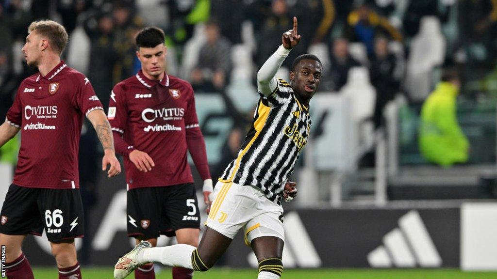 Timothy Weah points to the fans in celebration after scoring Juventus' sixth goal