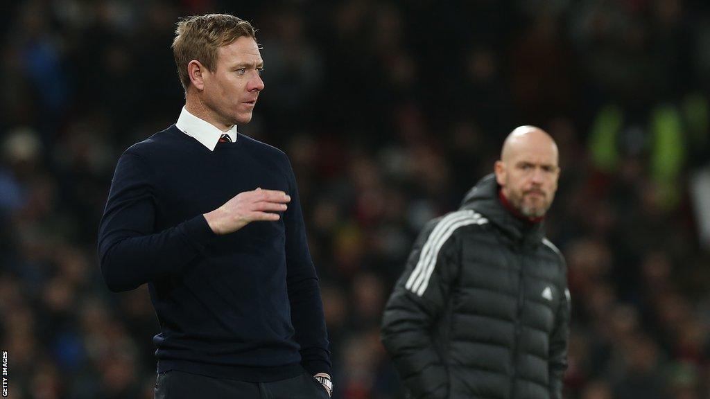 Dean Holden (left) in charge of Charlton at Manchester United