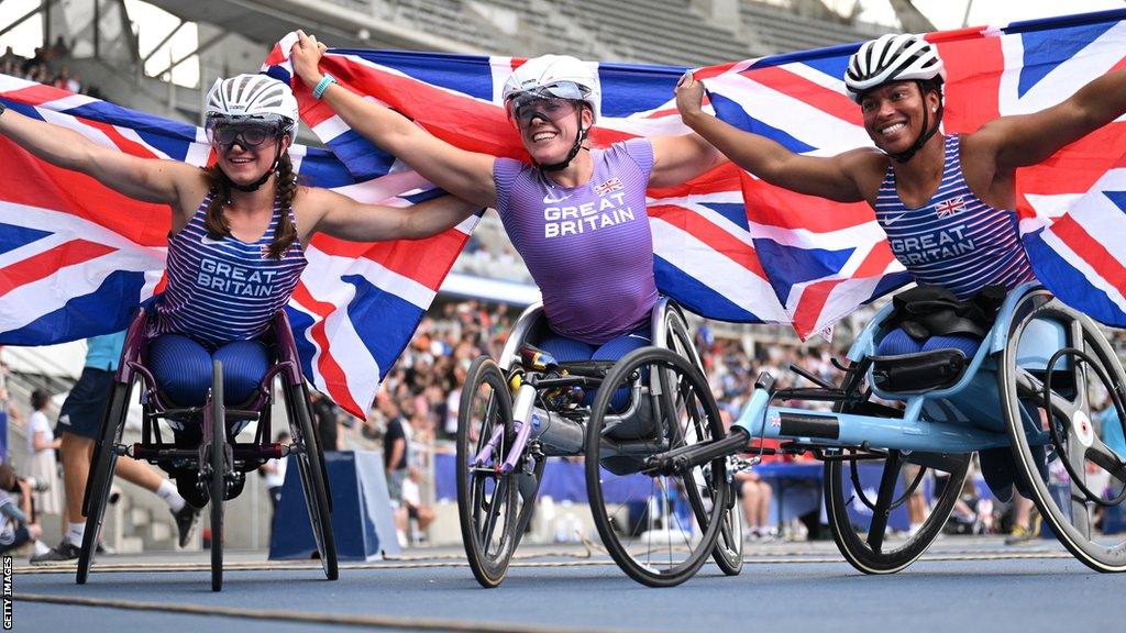 Wheelchair racers Fabienne Andre, Hannah Cockroft and Kare Adenegan celebrate their medals