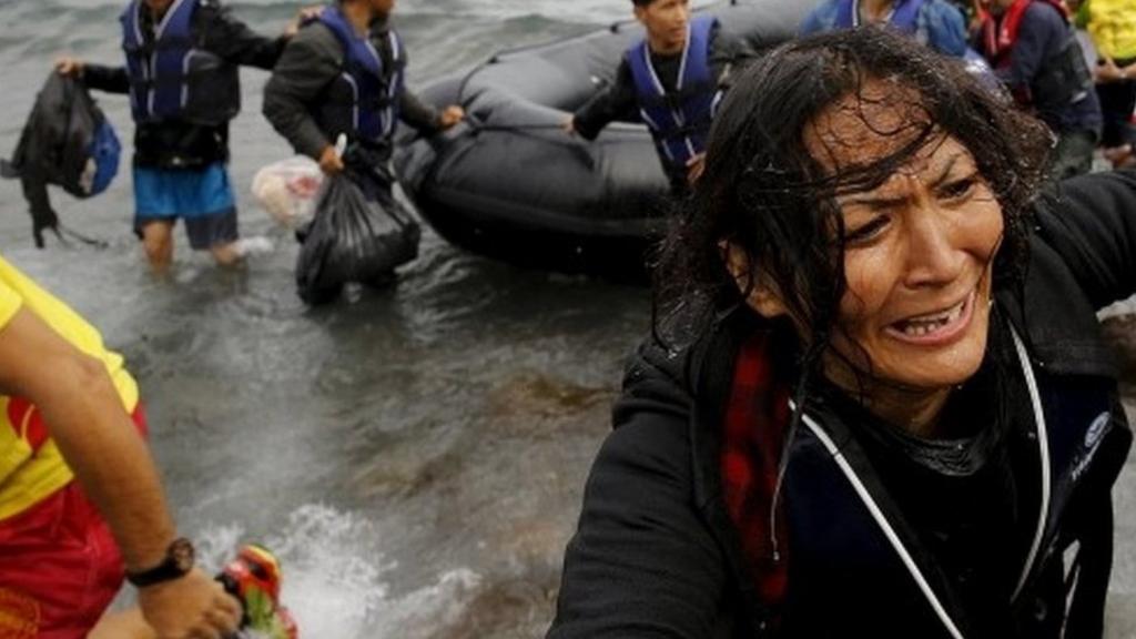 An Afghan migrant arrives on the Greek island of Lesbos in an overcrowded dinghy. Photo: 22 September 2015