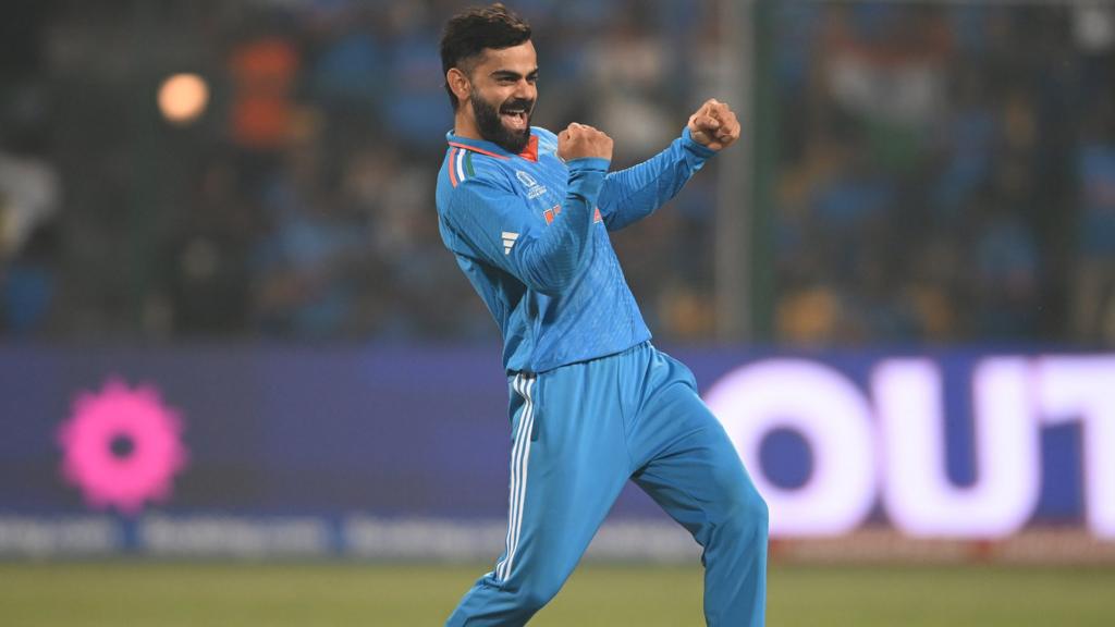 Virat Kohli celebrates taking a wicket