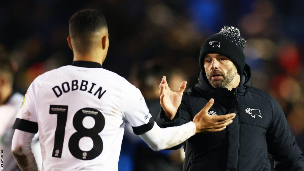 Derby boss Paul Warne gives Lewis Dobbin a high five