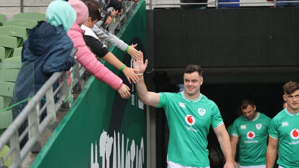 James Ryan greets fans as he runs on to the pitch for Ireland's captain's run