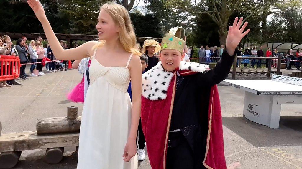 King Charles and Queen Camilla lead the procession