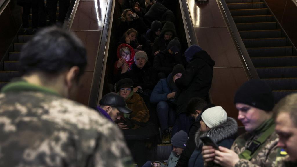 People take shelter inside a Kyiv metro station as Russian missile attacks hit Ukraine