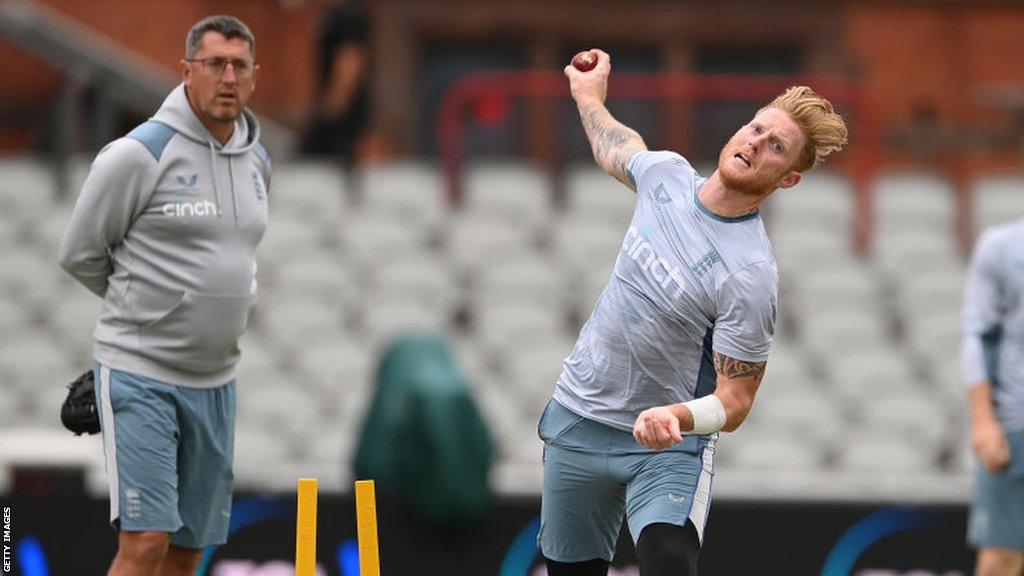 Jon Lewis watches Ben Stokes bowl in the nets for England