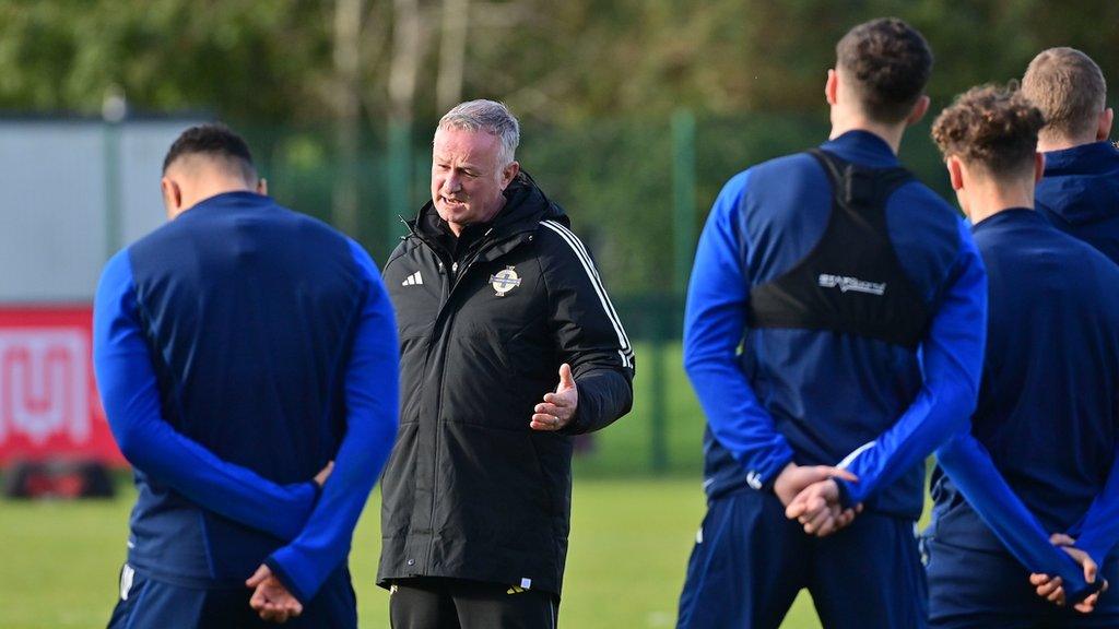 Michael O'Neill talks to his players during training for Friday night's qualifier in Helsinki