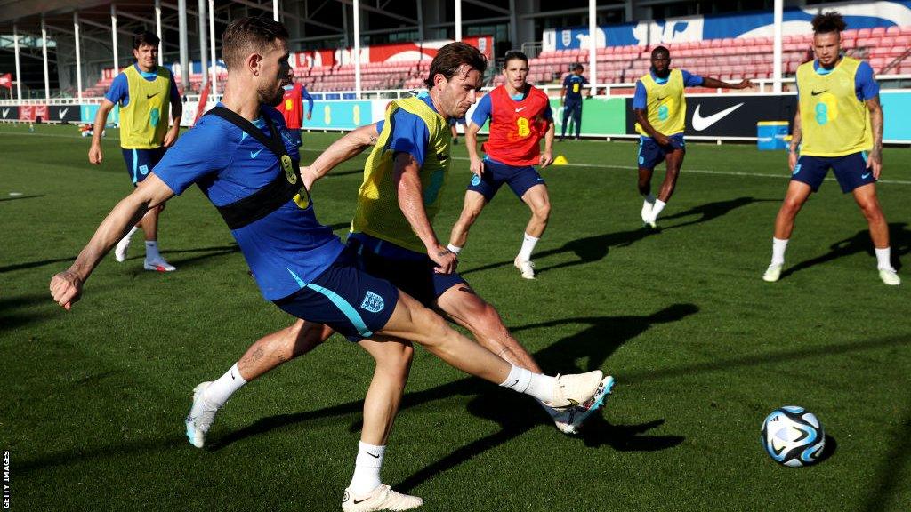 Jordan Henderson competes with Ben Chilwell for the ball