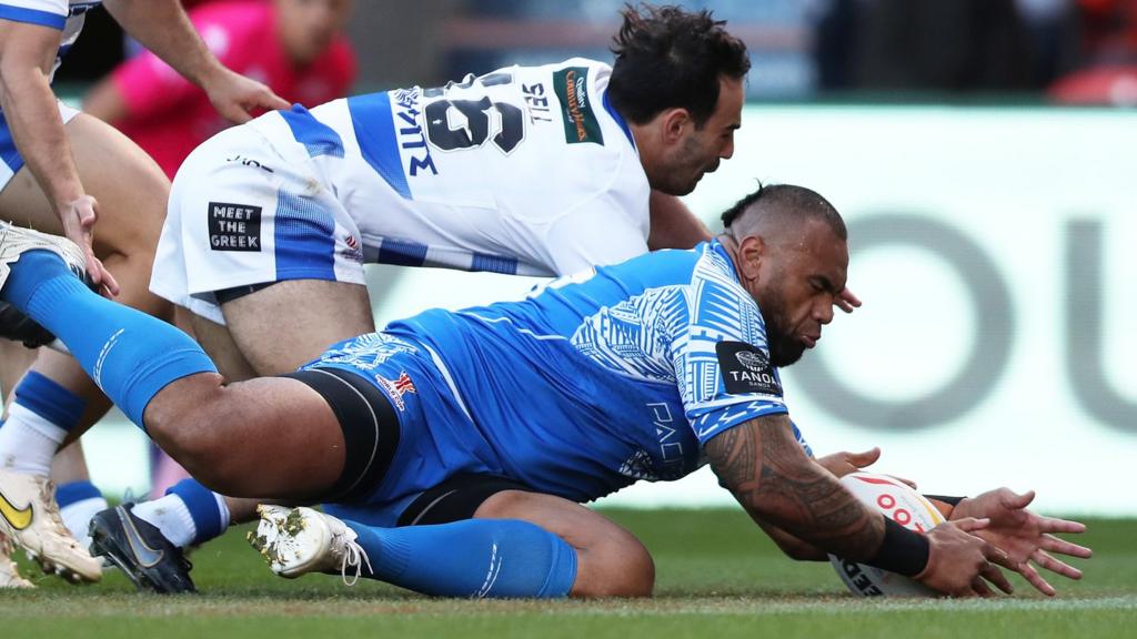 Junior Paulo scores a try for Samoa against Greece
