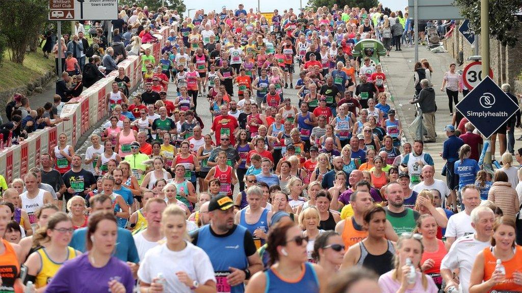 Thousands of runners make their way towards South Shields