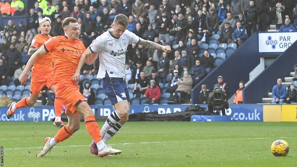 Ipswich's George Edmundson puts through his own net as he challenges Emil Riis