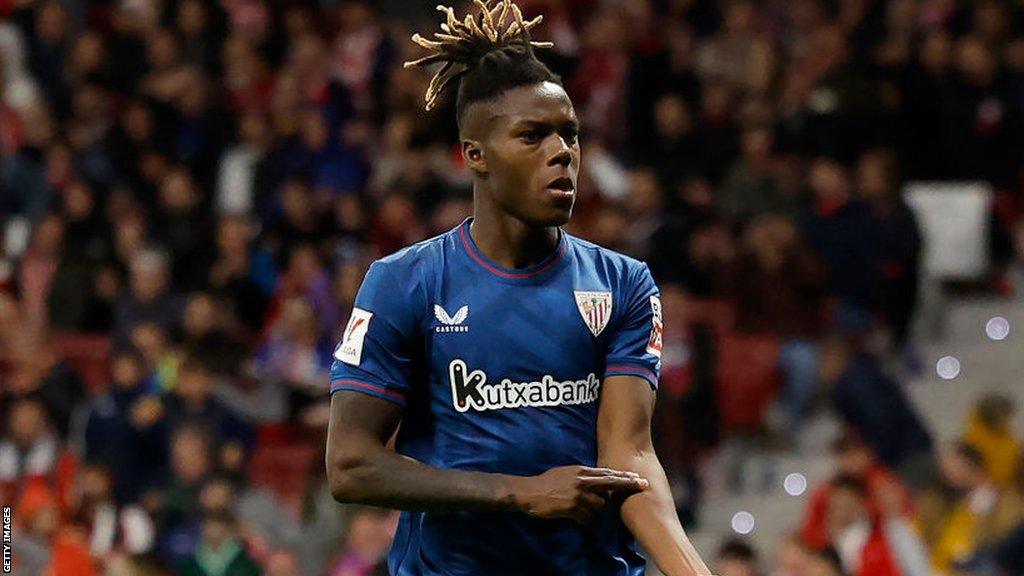 Nico Williams points to his skin after scoring for Athletic Bilbao against Atletico Madrid in La Liga