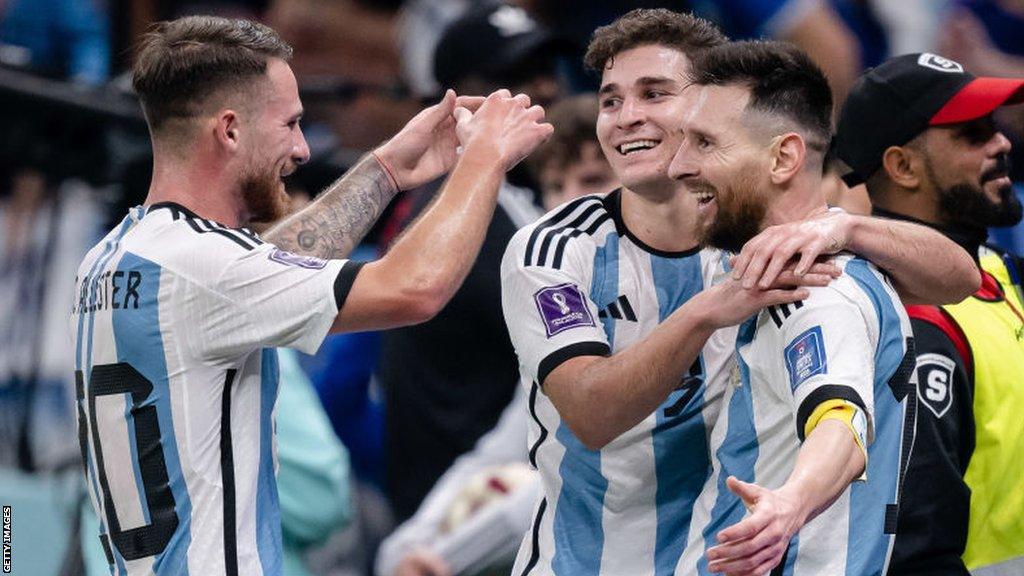 Alexis Mac Allister congratulates Lionel Messi after he scored a penalty in Argentina's semi-final win over Croatia