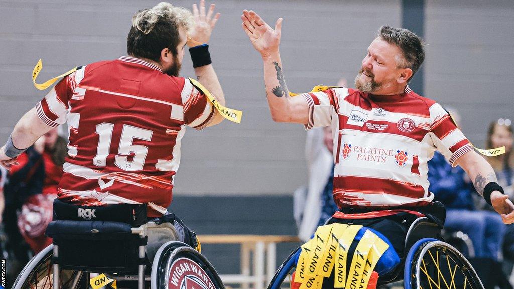 Wigan Warriors' Martin Lane (right) celebrates scoring one of his two tries in the Grand Final win over Leeds Rhinos