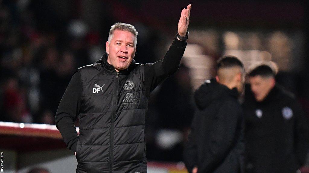 Peterborough manager Darren Ferguson shouts instructions from the dugout to his players during match