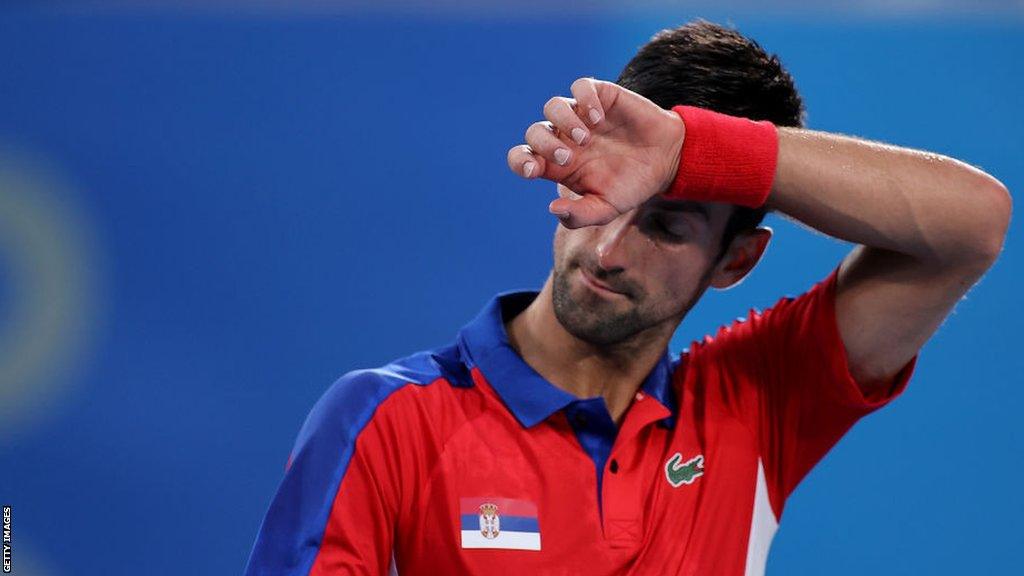 Novak Djokovic reacts during his defeat by Alexander Zverev at the Tokyo 2020 Olympics