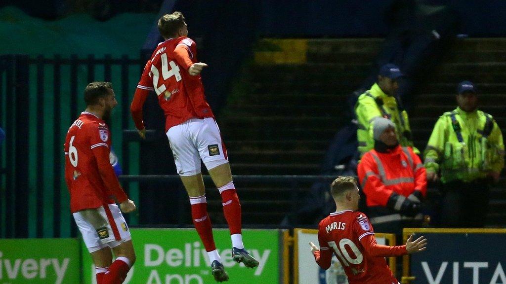 Mansfield players celebrate with George Maris