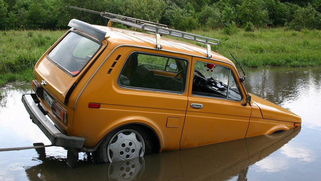 Car going into water