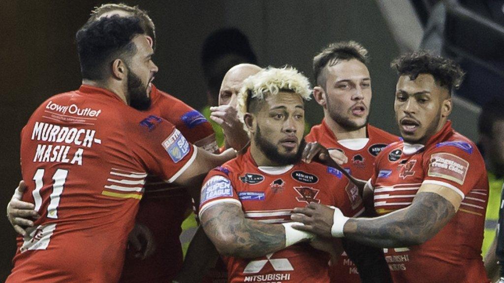 Junior Sa'u celebrates his try against Hull FC