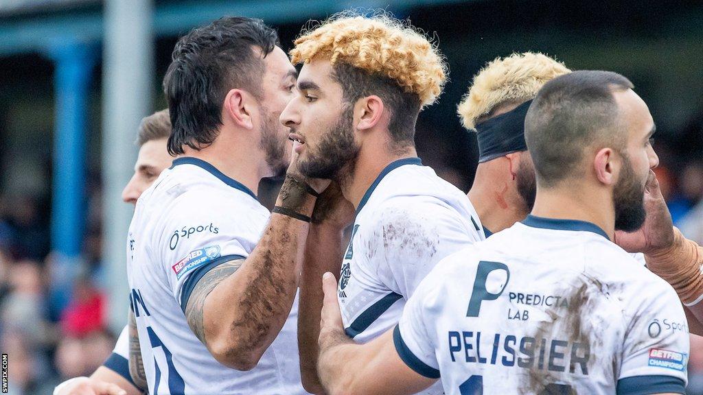 Toulouse players celebrate a try at Barrow