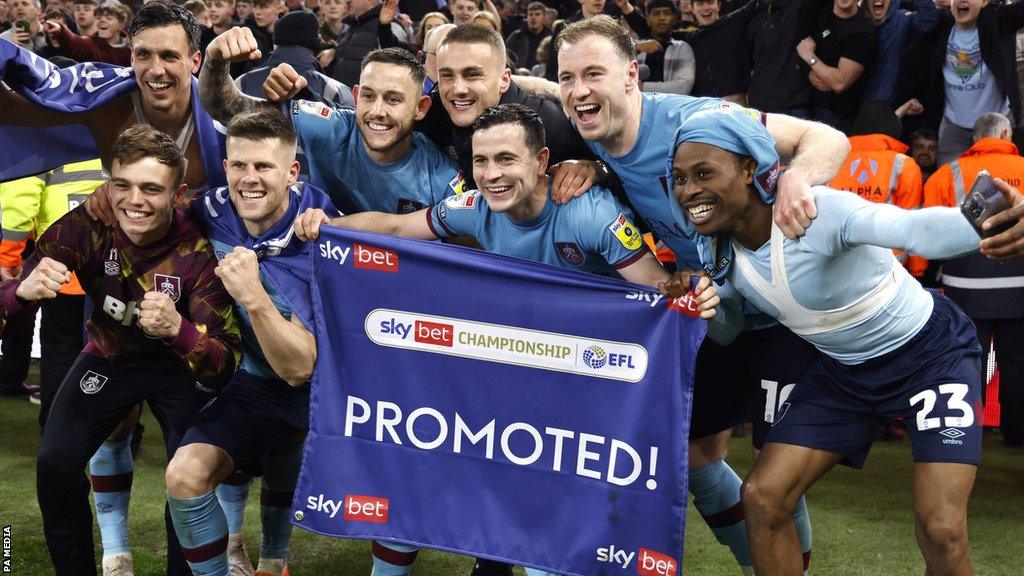 Burnley players celebrate promotion after beating Middlesbrough