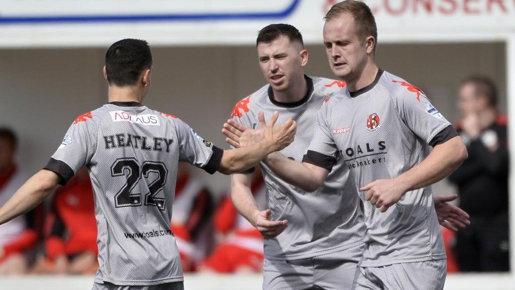 Jordan Owens celebrates with Paul Heatley