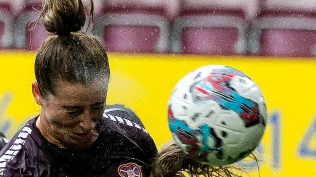 Kathleen McGovern heads the ball for Hearts