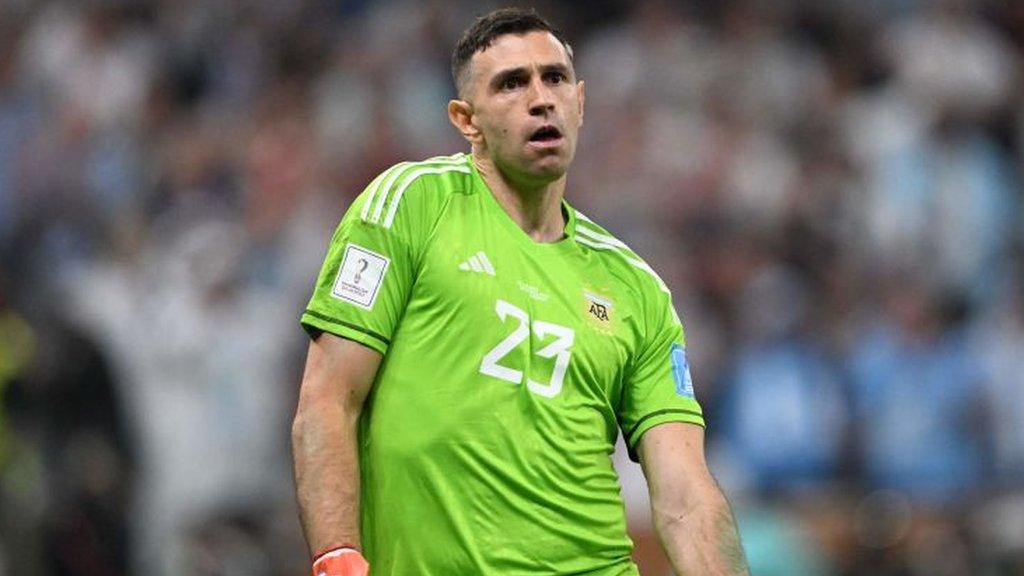 Emiliano Martinez celebrates after saving a penalty