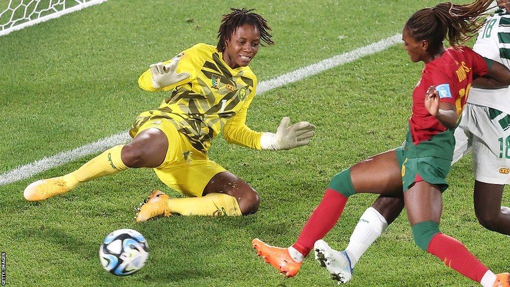 Cameroon keeper Cathy Biya makes a save