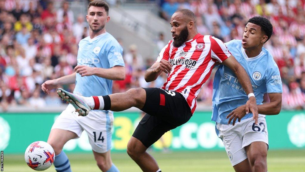 Shea Charles (right) battles with Brentford's Bryan Mbeumo