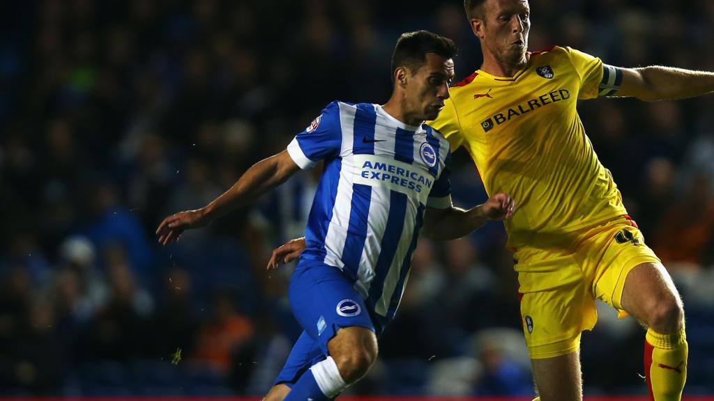 Sam Baldock and Danny Collins battle for the ball