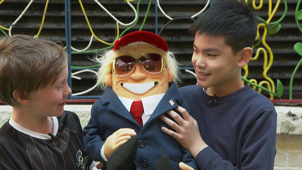 Children with a Donald Trump puppet.