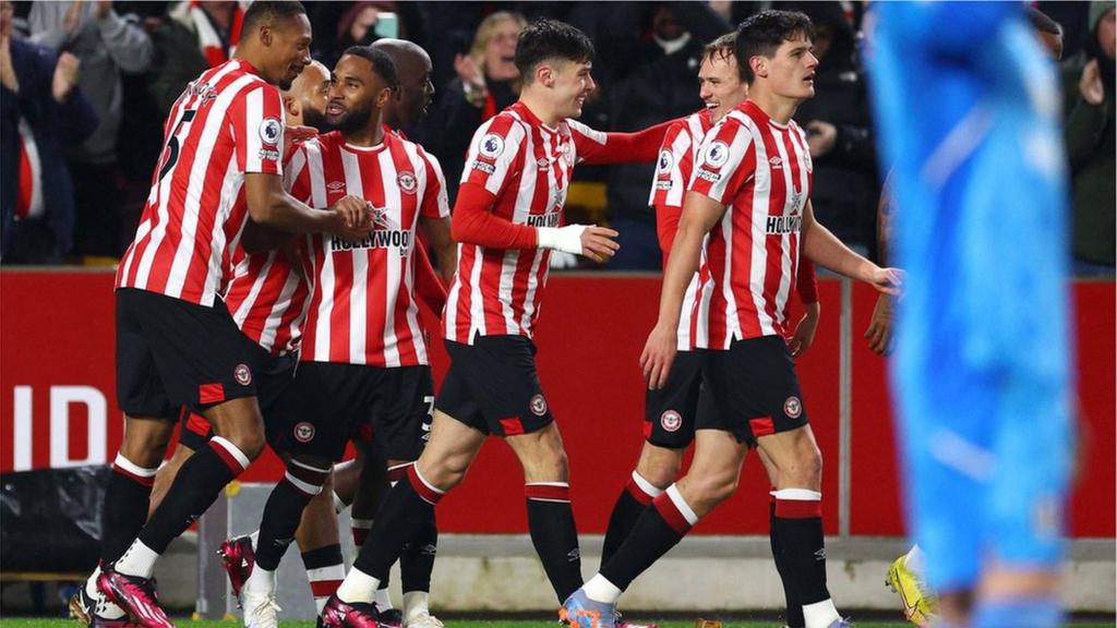 Ethan Pinnock (left) celebrates scoring