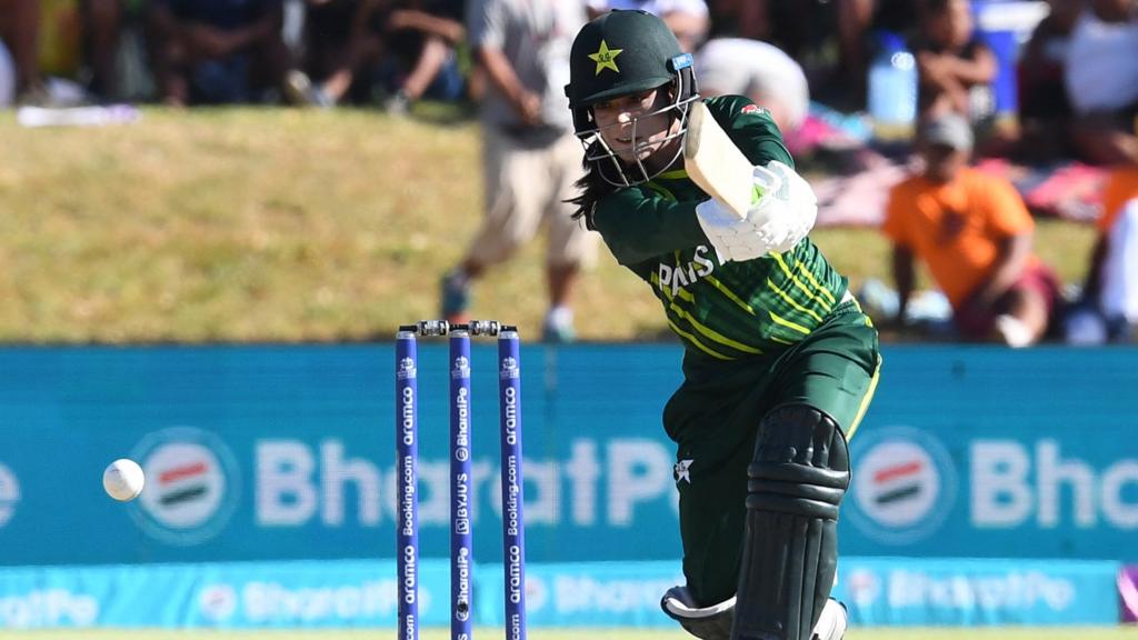 Pakistan's Sidra Ameen watches the ball after playing a shot