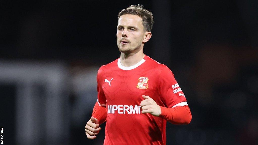 Liam Kinsella on the pitch for Swindon