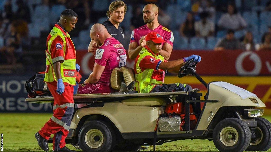 Jack Yeandle is helped off the field